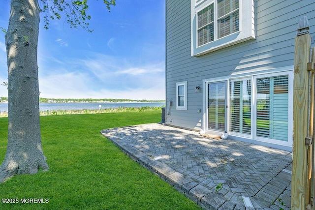 332 Seaview Cir, Neptune Township, NJ 07753 - view of green lawn with a water view, a patio, and central air condition unit