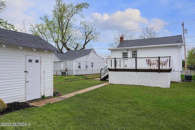 126 Seabreeze Ave, North Middletown, NJ 07748 - back of house featuring cooling unit, a wooden deck, a chimney, and roof with shingles