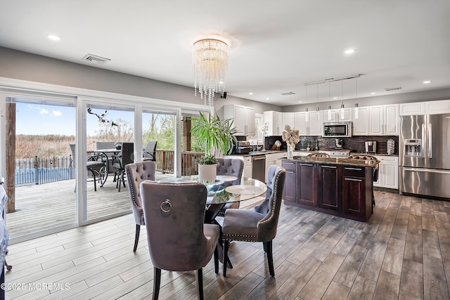 37 Florence Ave, Leonardo, NJ 07737 - dining area featuring a chandelier, wood finished floors, and recessed lighting
