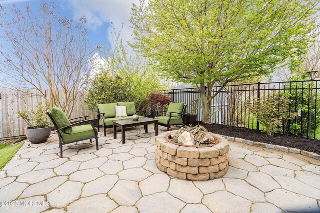 37 Florence Ave, Leonardo, NJ 07737 - fenced backyard with a patio area and an outdoor fire pit