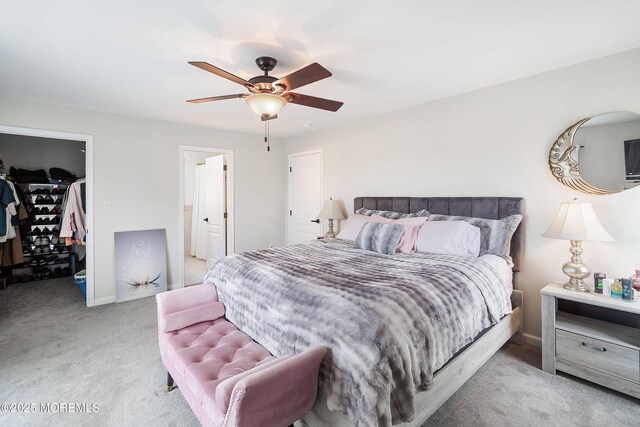 37 Florence Ave, Leonardo, NJ 07737 - carpeted bedroom with a walk in closet, a closet, a ceiling fan, baseboards, and connected bathroom