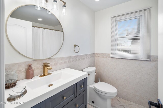 37 Florence Ave, Leonardo, NJ 07737 - bathroom with tile walls, vanity, a wainscoted wall, toilet, and tile patterned flooring