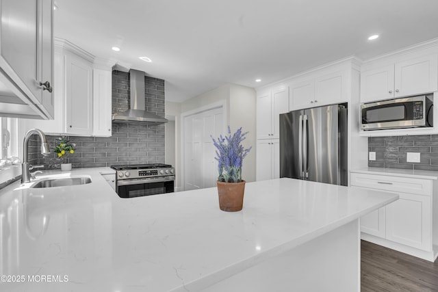 18 Heritage Dr, Edison, NJ 08820 - kitchen with stainless steel appliances, wall chimney range hood, a sink, decorative backsplash, and white cabinets