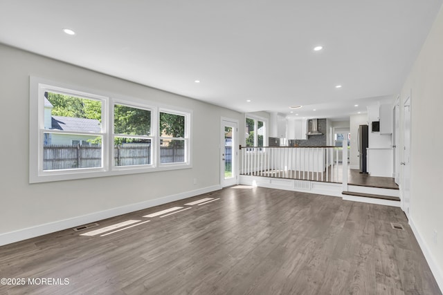 18 Heritage Dr, Edison, NJ 08820 - unfurnished living room with baseboards, dark wood-style floors, and recessed lighting