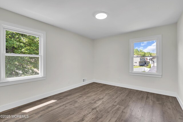 18 Heritage Dr, Edison, NJ 08820 - empty room featuring plenty of natural light, wood finished floors, and baseboards