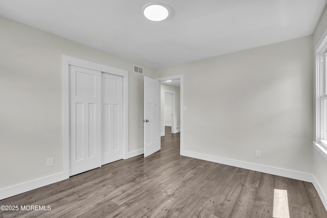 18 Heritage Dr, Edison, NJ 08820 - unfurnished bedroom featuring baseboards, wood finished floors, and a closet