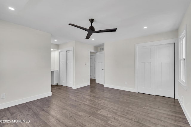 18 Heritage Dr, Edison, NJ 08820 - unfurnished bedroom featuring two closets, wood finished floors, baseboards, recessed lighting, and ceiling fan