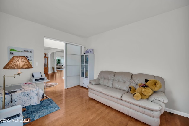 208 Bradwick Way, Marlboro, NJ 07746 - living room with wood finished floors, baseboards, and french doors