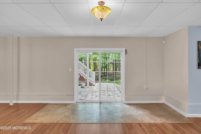 208 Bradwick Way, Marlboro, NJ 07746 - unfurnished room with wood finished floors, baseboards, and a paneled ceiling