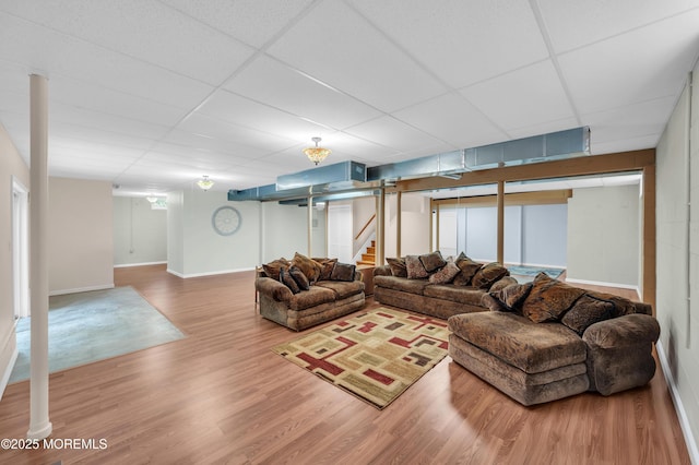 208 Bradwick Way, Marlboro, NJ 07746 - living room with stairway, a drop ceiling, wood finished floors, and baseboards