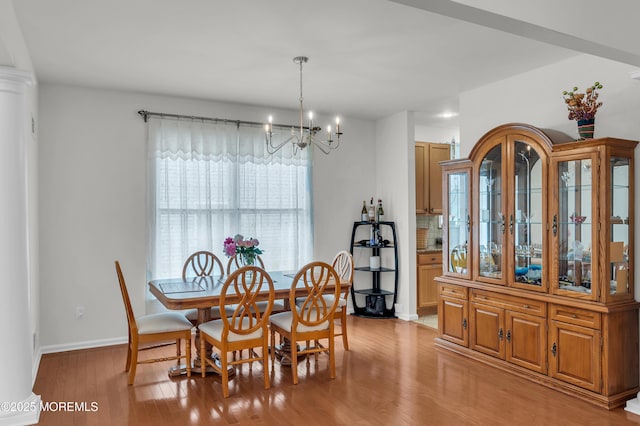 208 Bradwick Way, Marlboro, NJ 07746 - dining room featuring light wood-style floors, a chandelier, and baseboards
