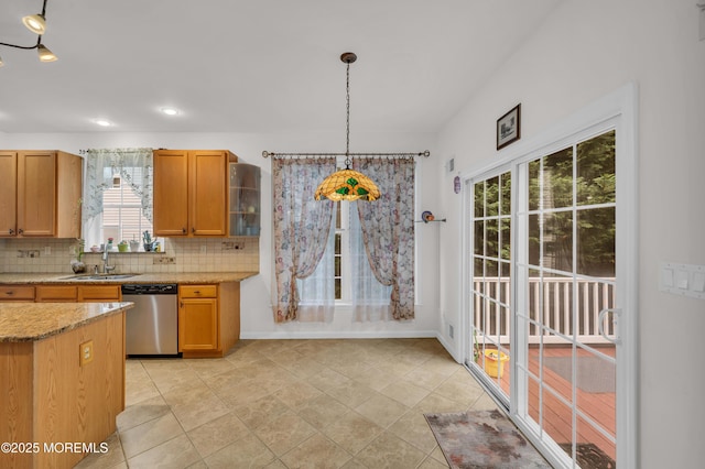 208 Bradwick Way, Marlboro, NJ 07746 - kitchen featuring stainless steel dishwasher, a sink, tasteful backsplash, hanging light fixtures, and light stone countertops