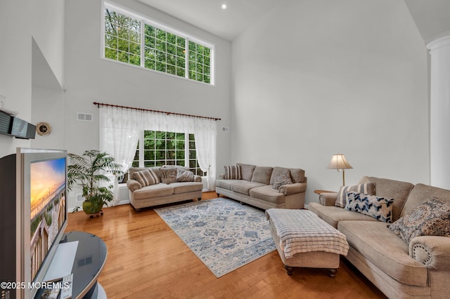 208 Bradwick Way, Marlboro, NJ 07746 - living area with a high ceiling, wood finished floors, ornate columns, and recessed lighting