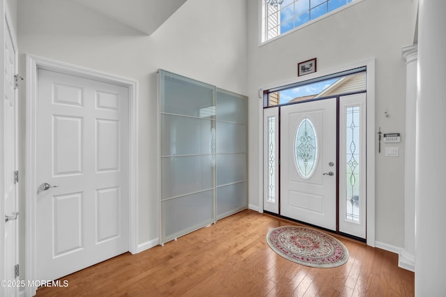208 Bradwick Way, Marlboro, NJ 07746 - foyer entrance featuring wood finished floors, baseboards, and a towering ceiling