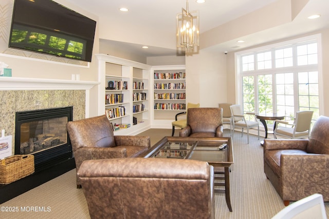 208 Bradwick Way, Marlboro, NJ 07746 - carpeted living room featuring recessed lighting, a premium fireplace, built in features, and a chandelier