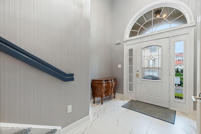 17 Riviera Dr, Long Branch, NJ 07740 - foyer with marble look tile flooring, healthy amount of natural light, and baseboards