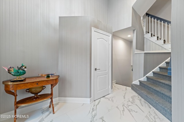 17 Riviera Dr, Long Branch, NJ 07740 - entryway featuring stairway, marble finish flooring, and baseboards