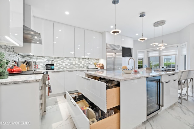 17 Riviera Dr, Long Branch, NJ 07740 - kitchen featuring modern cabinets, stainless steel built in fridge, wine cooler, range, and white cabinetry