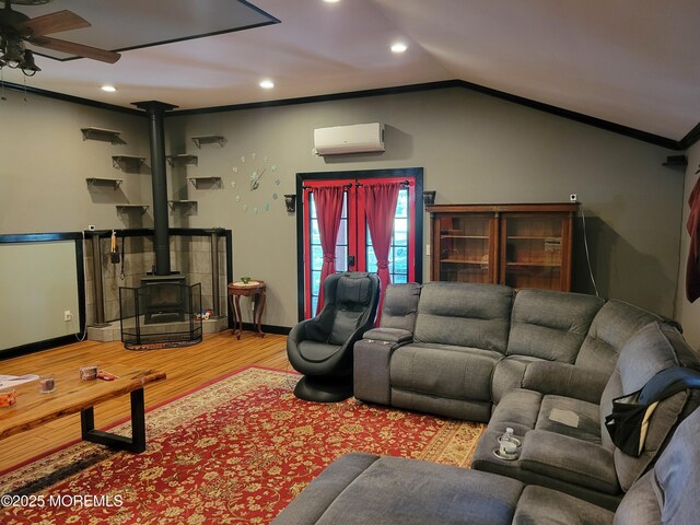 157 Taylors Mills Rd, Englishtown, NJ 07726 - living area featuring a wood stove, ceiling fan, recessed lighting, wood finished floors, and a wall mounted AC