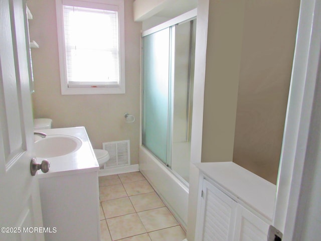 313 Merrimac Rd, Forked River, NJ 08731 - bathroom featuring toilet, vanity, tile patterned floors, and shower / bath combination with glass door