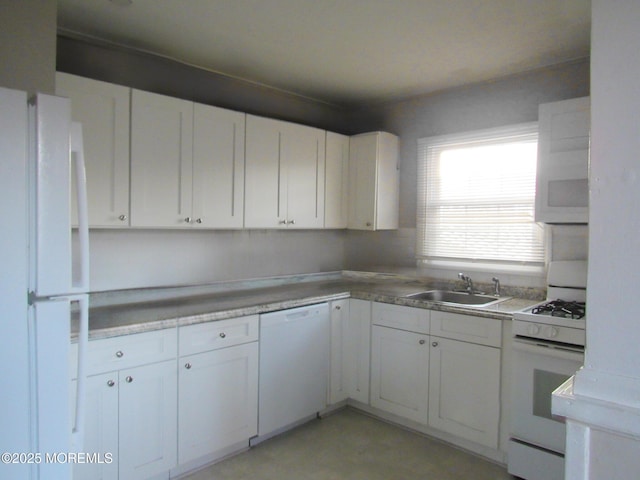 710 Baltic Dr, Brick, NJ 08723 - kitchen with white appliances, a sink, and white cabinetry