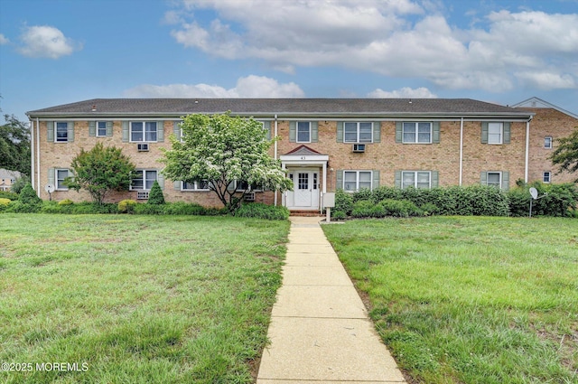 43 Manchester Ct Unit F, Freehold, NJ 07728 - view of front of house with a front lawn and brick siding