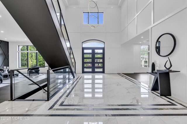 30 Winchester Ln, Holmdel, NJ 07733 - foyer featuring marble tiled flooring, a towering ceiling, french doors, inlaid floor details, and recessed lighting