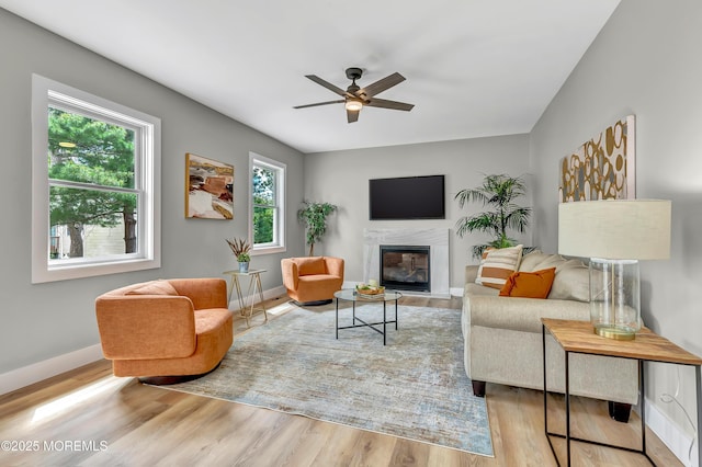7 Cardinal Ave, Brick, NJ 08724 - living area featuring a glass covered fireplace, baseboards, ceiling fan, and wood finished floors