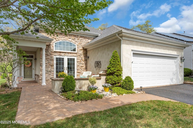 28 Pierhead Dr, Barnegat, NJ 08005 - traditional home with stucco siding, driveway, stone siding, a garage, and roof with shingles