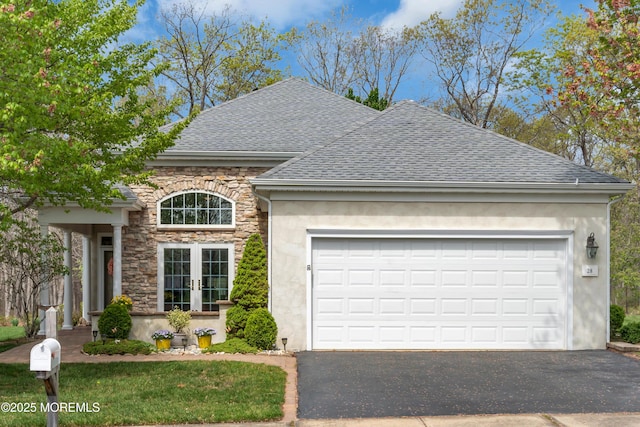 28 Pierhead Dr, Barnegat, NJ 08005 - view of front of home with a shingled roof, stone siding, driveway, stucco siding, and a garage
