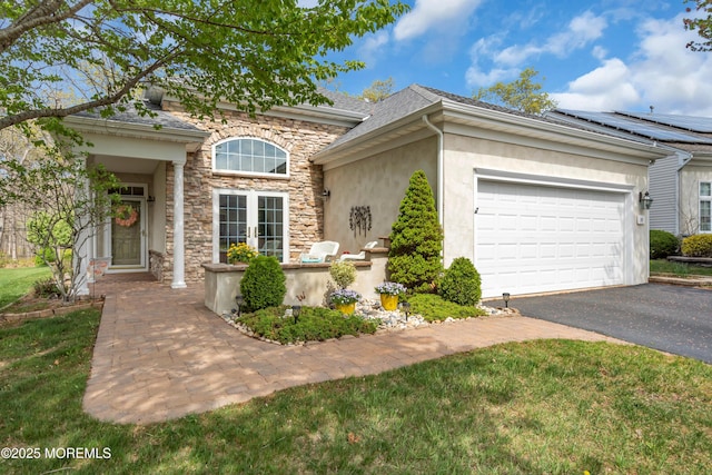 28 Pierhead Dr, Barnegat, NJ 08005 - traditional-style house with stone siding, driveway, stucco siding, a garage, and a front lawn