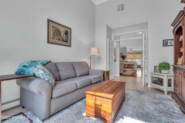 28 Pierhead Dr, Barnegat, NJ 08005 - tiled living area featuring baseboard heating and french doors