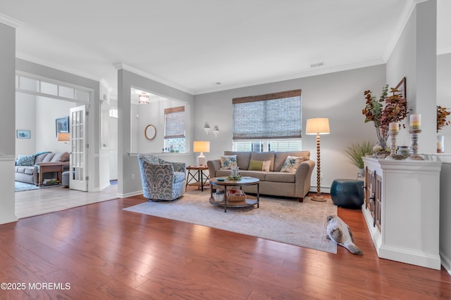 28 Pierhead Dr, Barnegat, NJ 08005 - living area with wood finished floors, ornamental molding, a baseboard radiator, and baseboards