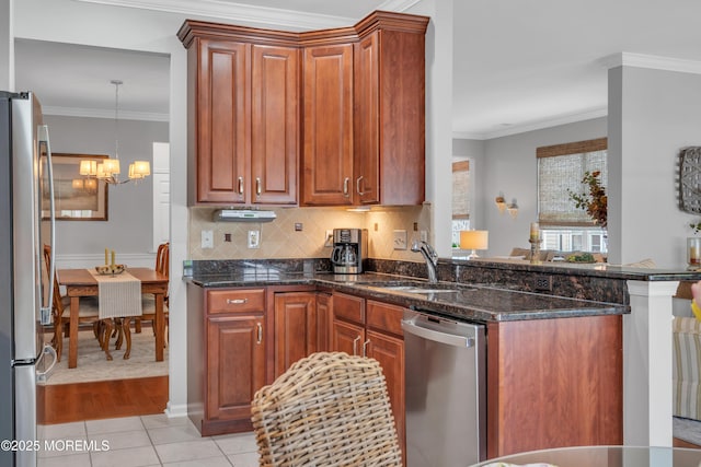 28 Pierhead Dr, Barnegat, NJ 08005 - kitchen featuring appliances with stainless steel finishes, a sink, ornamental molding, a chandelier, and dark stone countertops