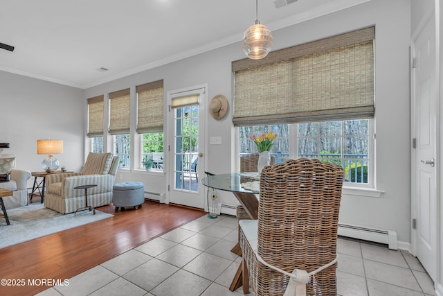 28 Pierhead Dr, Barnegat, NJ 08005 - tiled dining space with baseboard heating, healthy amount of natural light, and ornamental molding
