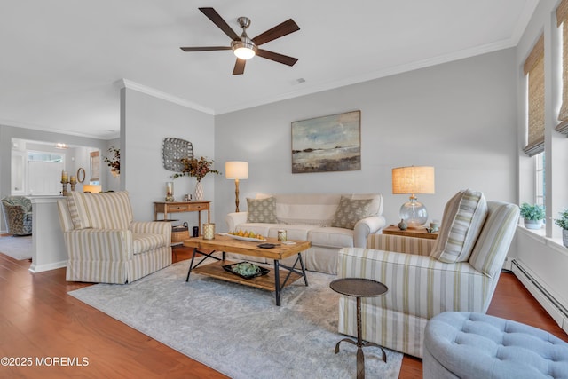 28 Pierhead Dr, Barnegat, NJ 08005 - living area with wood finished floors, a baseboard heating unit, a ceiling fan, ornamental molding, and baseboards