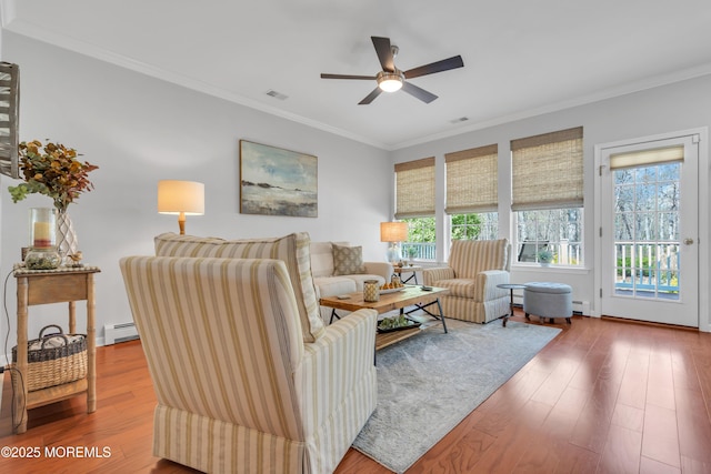 28 Pierhead Dr, Barnegat, NJ 08005 - living area with a baseboard heating unit, crown molding, ceiling fan, and wood finished floors