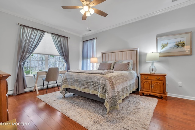 28 Pierhead Dr, Barnegat, NJ 08005 - bedroom with crown molding, hardwood / wood-style flooring, baseboards, a baseboard radiator, and a ceiling fan