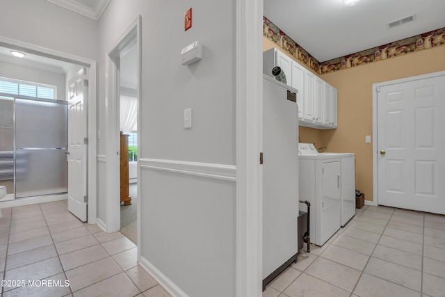 28 Pierhead Dr, Barnegat, NJ 08005 - laundry room featuring washer and clothes dryer, light tile patterned floors, cabinet space, ornamental molding, and baseboards