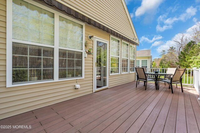 28 Pierhead Dr, Barnegat, NJ 08005 - wooden terrace with outdoor dining area