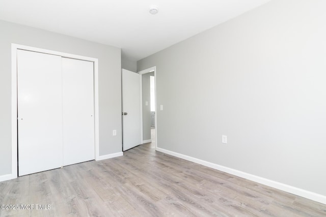 3 Fontana St, Toms River, NJ 08757 - unfurnished bedroom with light wood-style flooring, a closet, and baseboards