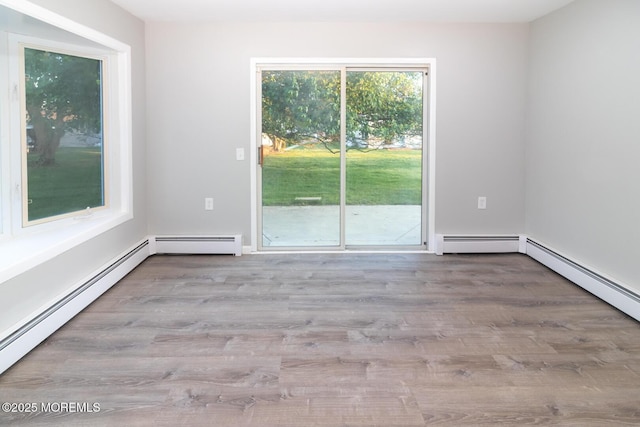 3 Fontana St, Toms River, NJ 08757 - empty room featuring baseboard heating and wood finished floors