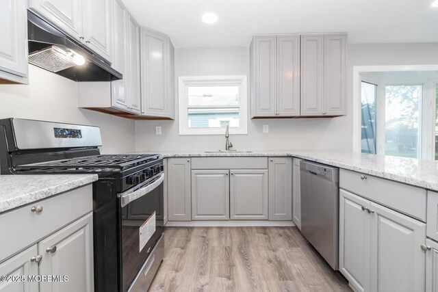 3 Fontana St, Toms River, NJ 08757 - kitchen featuring stainless steel appliances, under cabinet range hood, light wood finished floors, plenty of natural light, and recessed lighting