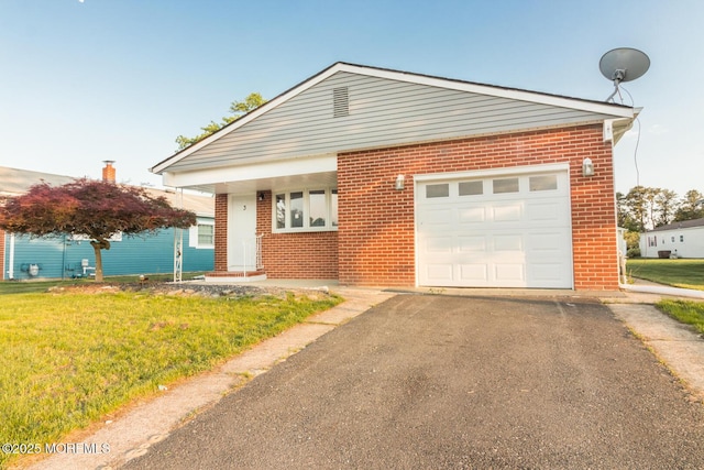 3 Fontana St, Toms River, NJ 08757 - view of front of property featuring brick siding, driveway, an attached garage, and a front lawn
