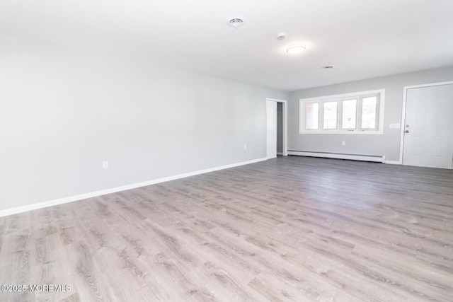 3 Fontana St, Toms River, NJ 08757 - empty room with a baseboard radiator, wood finished floors, and baseboards
