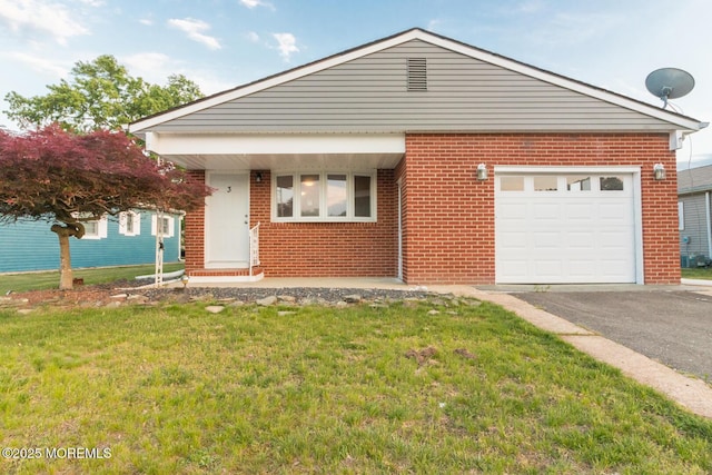 3 Fontana St, Toms River, NJ 08757 - view of front facade with brick siding, a front lawn, driveway, and an attached garage