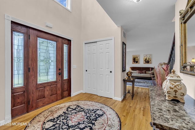16 W Ave, Gladstone, NJ 07934 - entryway featuring light wood-style flooring and a towering ceiling