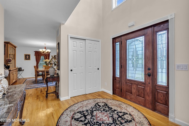16 W Ave, Gladstone, NJ 07934 - entryway with a chandelier and light wood-style floors