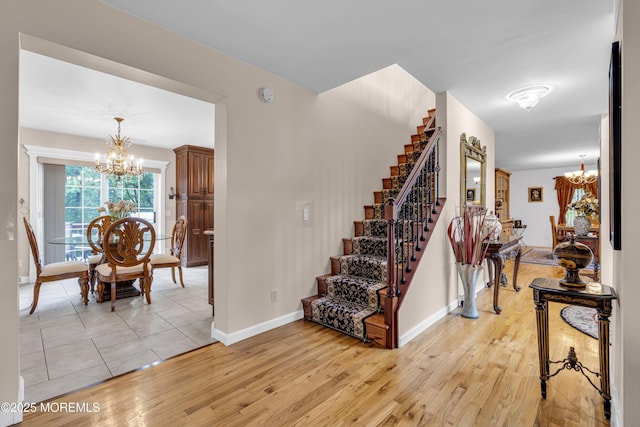 16 W Ave, Gladstone, NJ 07934 - stairway with a chandelier and wood finished floors