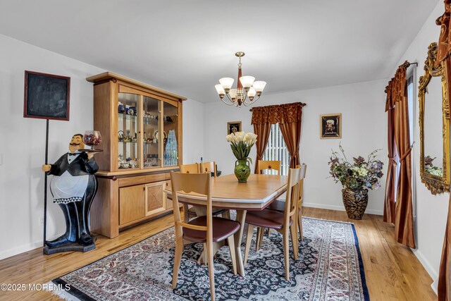 16 W Ave, Gladstone, NJ 07934 - dining room with a chandelier and light wood-type flooring
